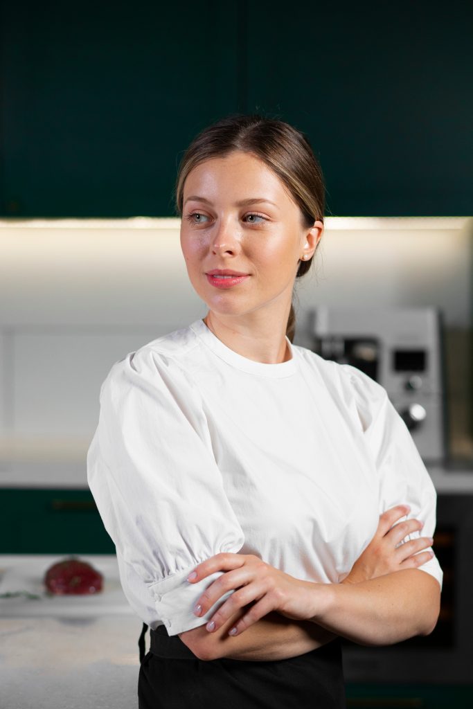 medium shot smiley woman kitchen scaled